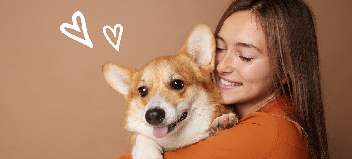 Pet mom hugging a dog