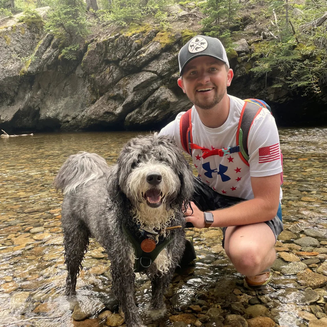 Tanner and Winston at a creek on a hike